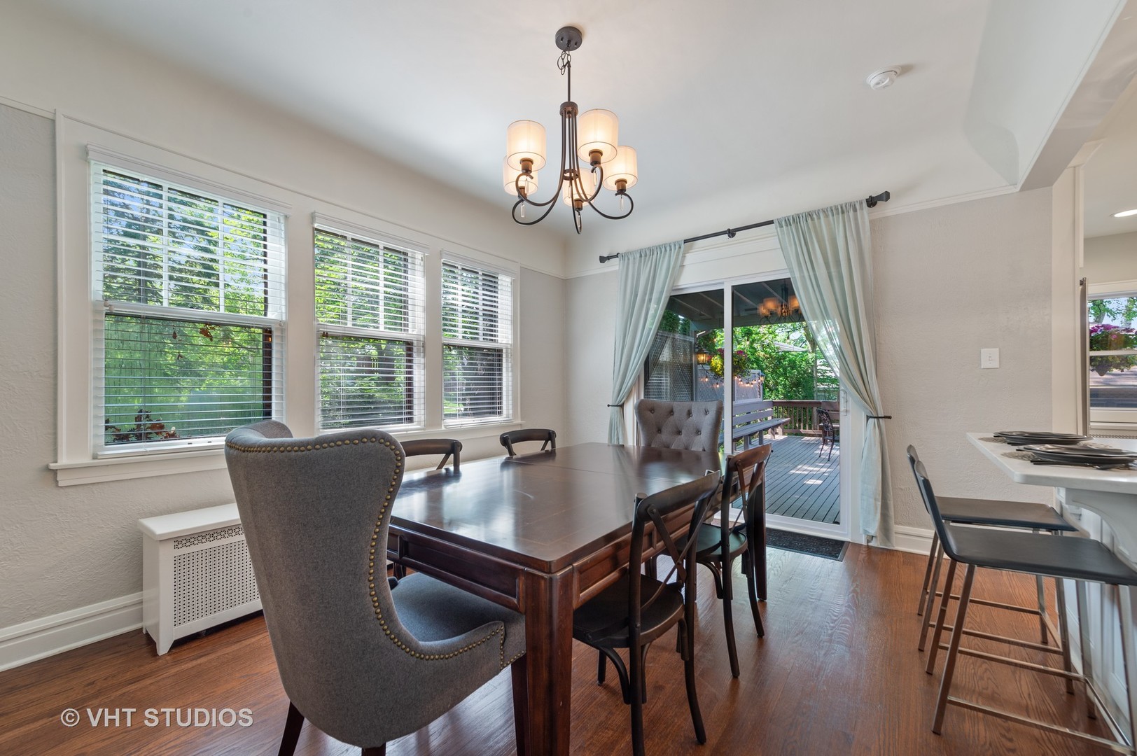 510 Berkeley Road Riverside, IL 60546 - Photo 5 of 30 a dining room with furniture a chandelier and wooden floor