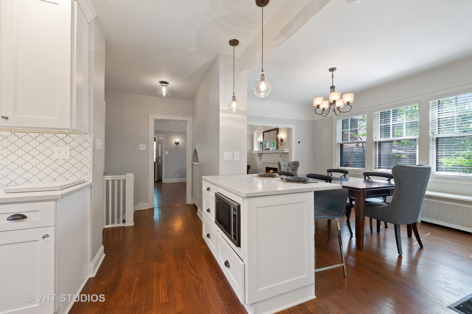 510 Berkeley Road Riverside, IL 60546 - Photo 9 of 30 a kitchen with a stove and wooden floor