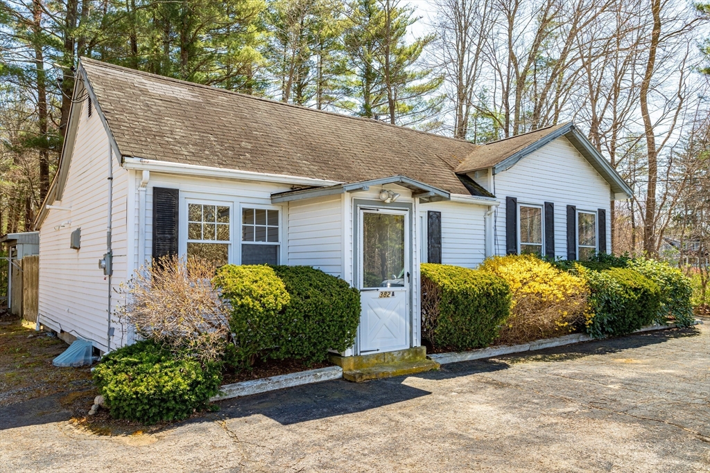 382 West Main Street Groton, MA 01450 - Photo 1 of 38 a view of a house with a yard and plants