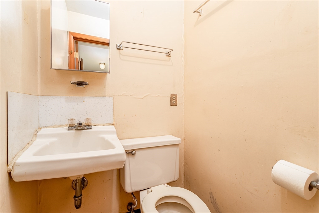 382 West Main Street Groton, MA 01450 - Photo 14 of 38 a bathroom with a sink a toilet and mirror