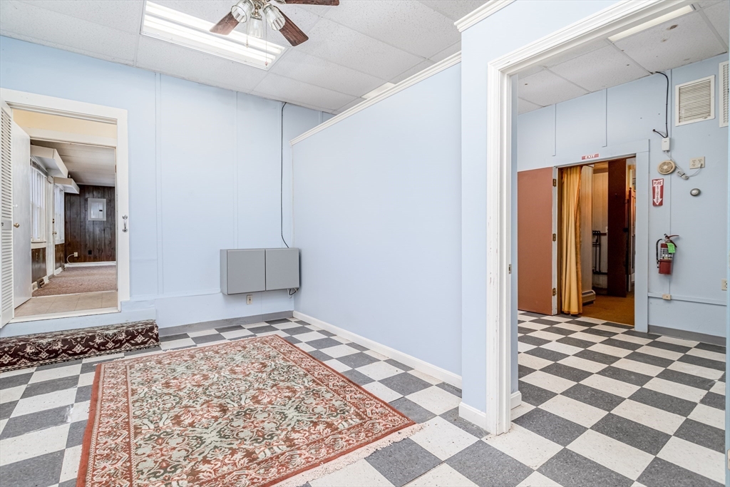 382 West Main Street Groton, MA 01450 - Photo 18 of 38 a view of a hallway to a room with a rug and a window