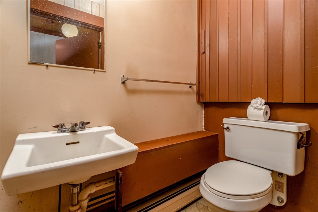 382 West Main Street Groton, MA 01450 - Photo 20 of 38 a bathroom with a sink a toilet and mirror