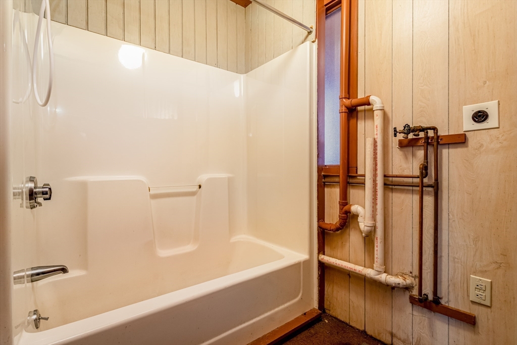 382 West Main Street Groton, MA 01450 - Photo 21 of 38 a bathroom with a bathtub and a shower