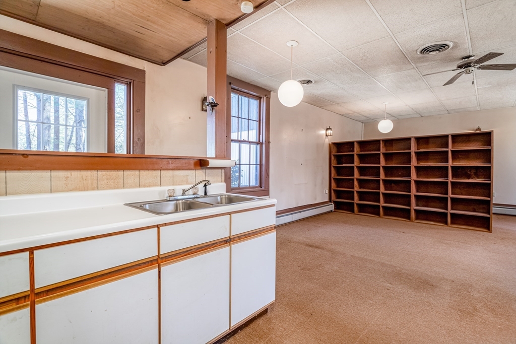 382 West Main Street Groton, MA 01450 - Photo 22 of 38 a view of an empty room with a staircase