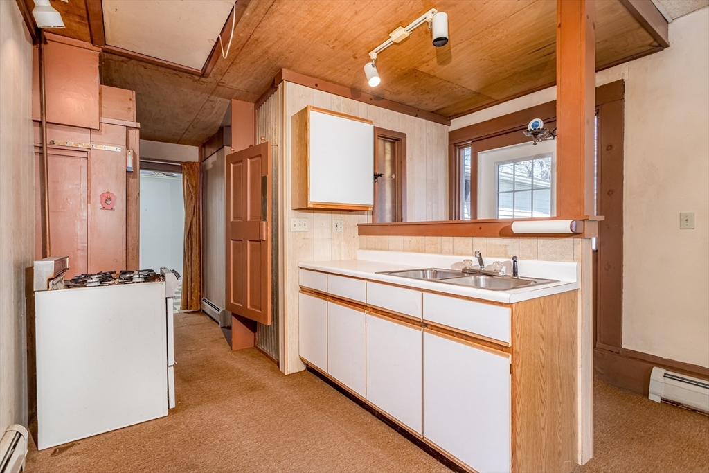 382 West Main Street Groton, MA 01450 - Photo 23 of 38 a bathroom with a sink and a mirror
