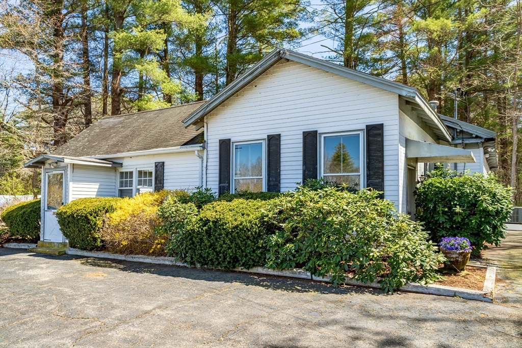 382 West Main Street Groton, MA 01450 - Photo 29 of 38 a front view of house with yard and trees around