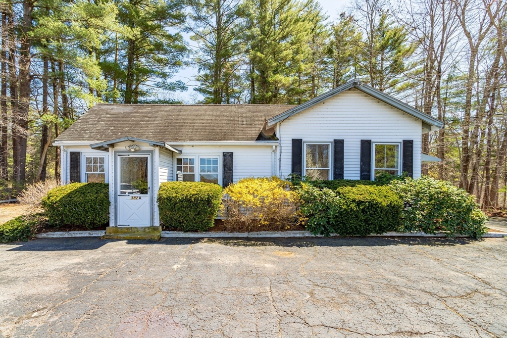 382 West Main Street Groton, MA 01450 - Photo 3 of 38 a front view of a house with a garden