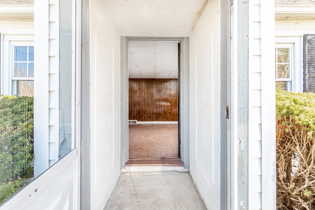 382 West Main Street Groton, MA 01450 - Photo 5 of 38 a view of a hallway with a wooden door