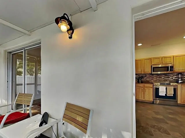 a view of an empty room and a window