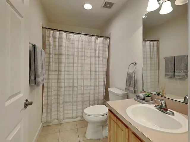 a view of a storage and utility room with washer and dryer
