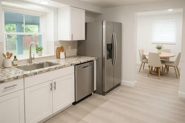 a living room with furniture a rug and a table