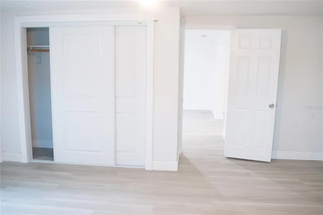 a view of a small space with wooden floor