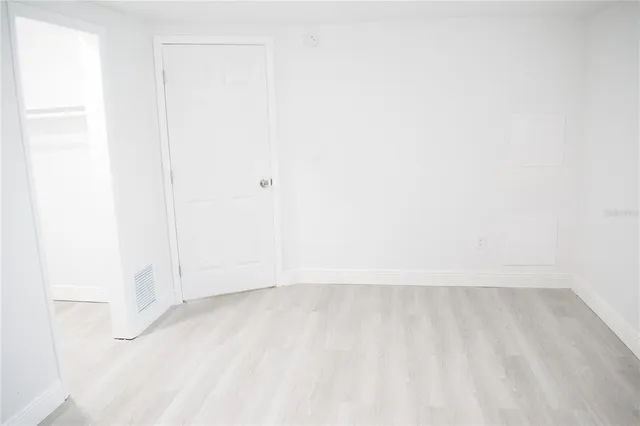 a kitchen with a sink cabinets and a refrigerator