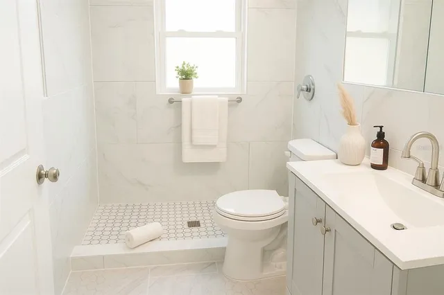 a bedroom with a bed and a night stand