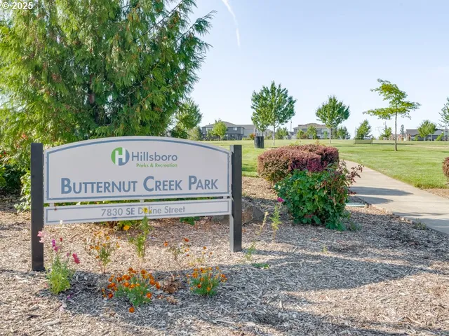 a view of a sign board with yard