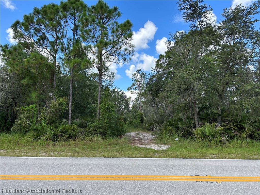 6835 Sparta Road Sebring, FL 33875 - Photo 1 of 22 a view of lake with green space