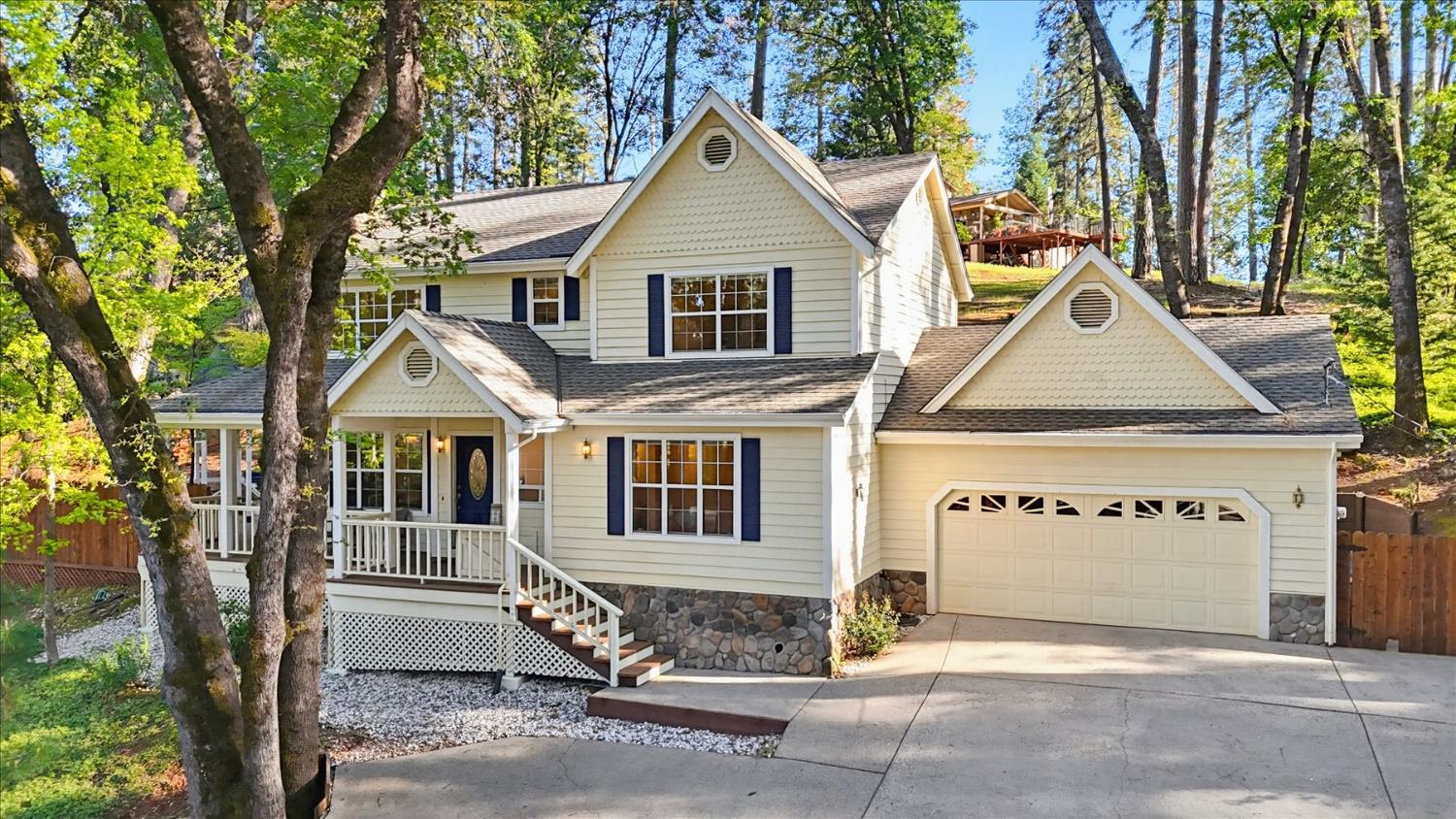 21324 Oak Ridge Drive Grass Valley, CA 95945 - Photo 1 of 32 a view of a white house