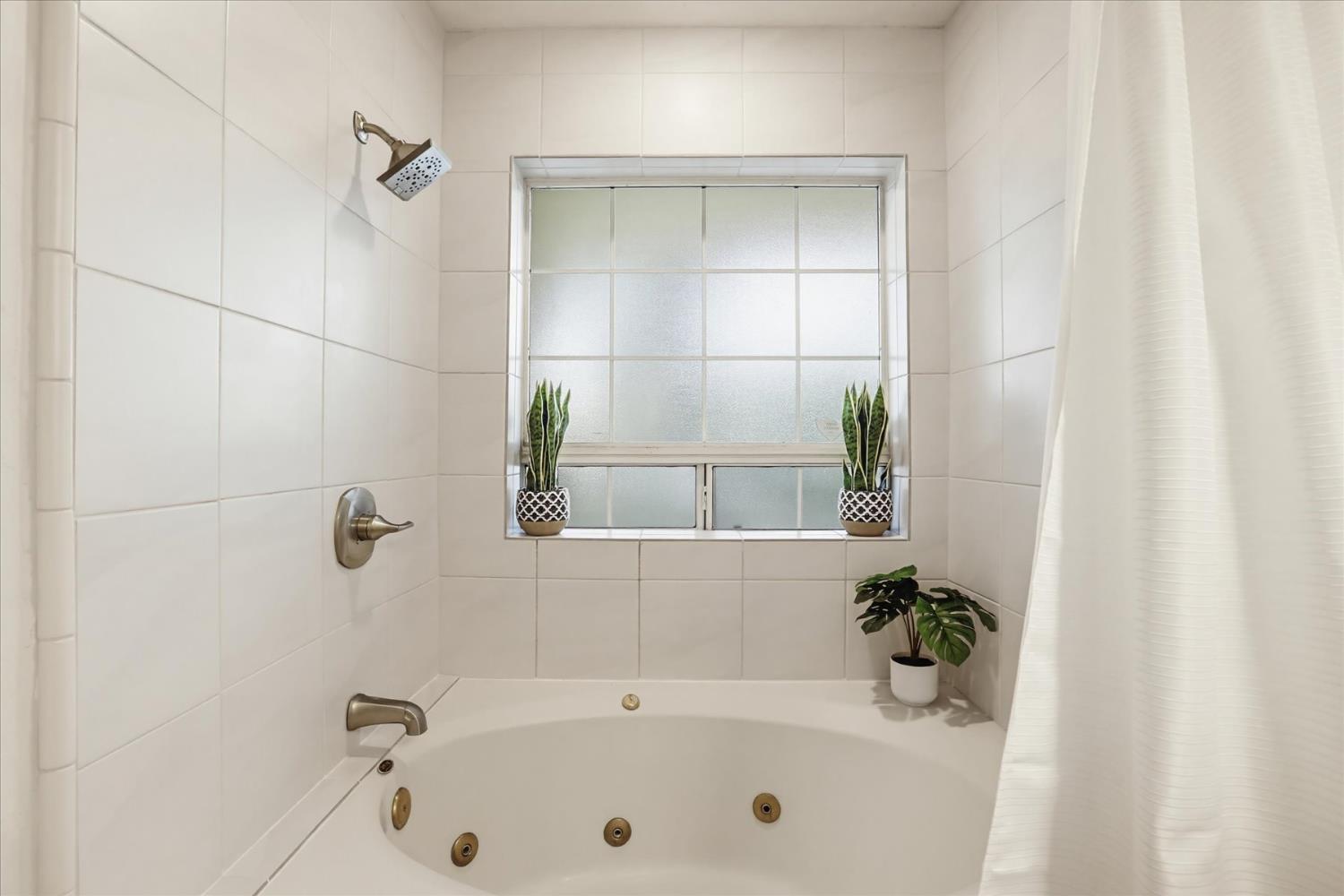 21324 Oak Ridge Drive Grass Valley, CA 95945 - Photo 13 of 32 a bathroom with a tub and shower