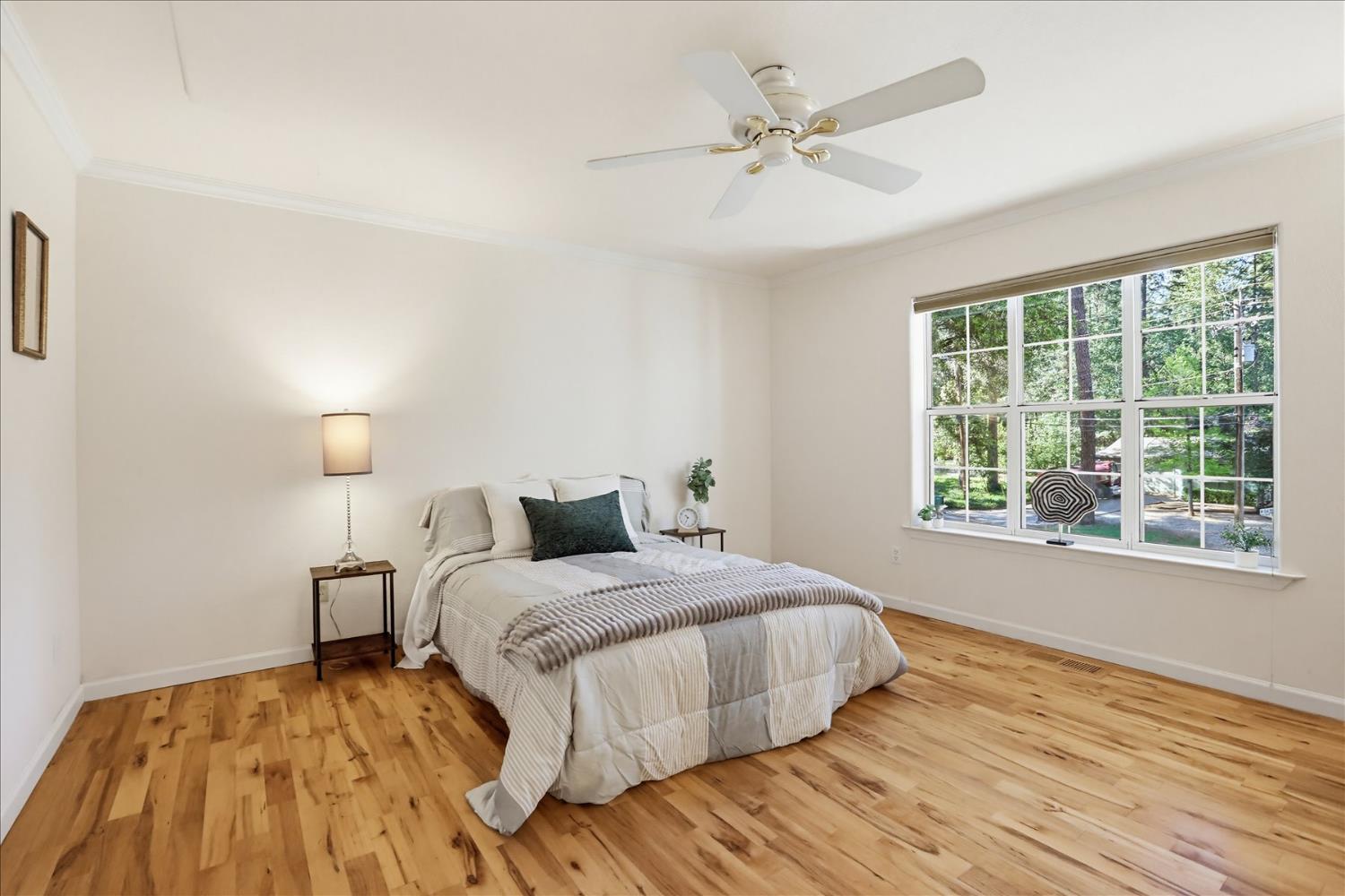 21324 Oak Ridge Drive Grass Valley, CA 95945 - Photo 14 of 32 a bedroom with a bed and a window