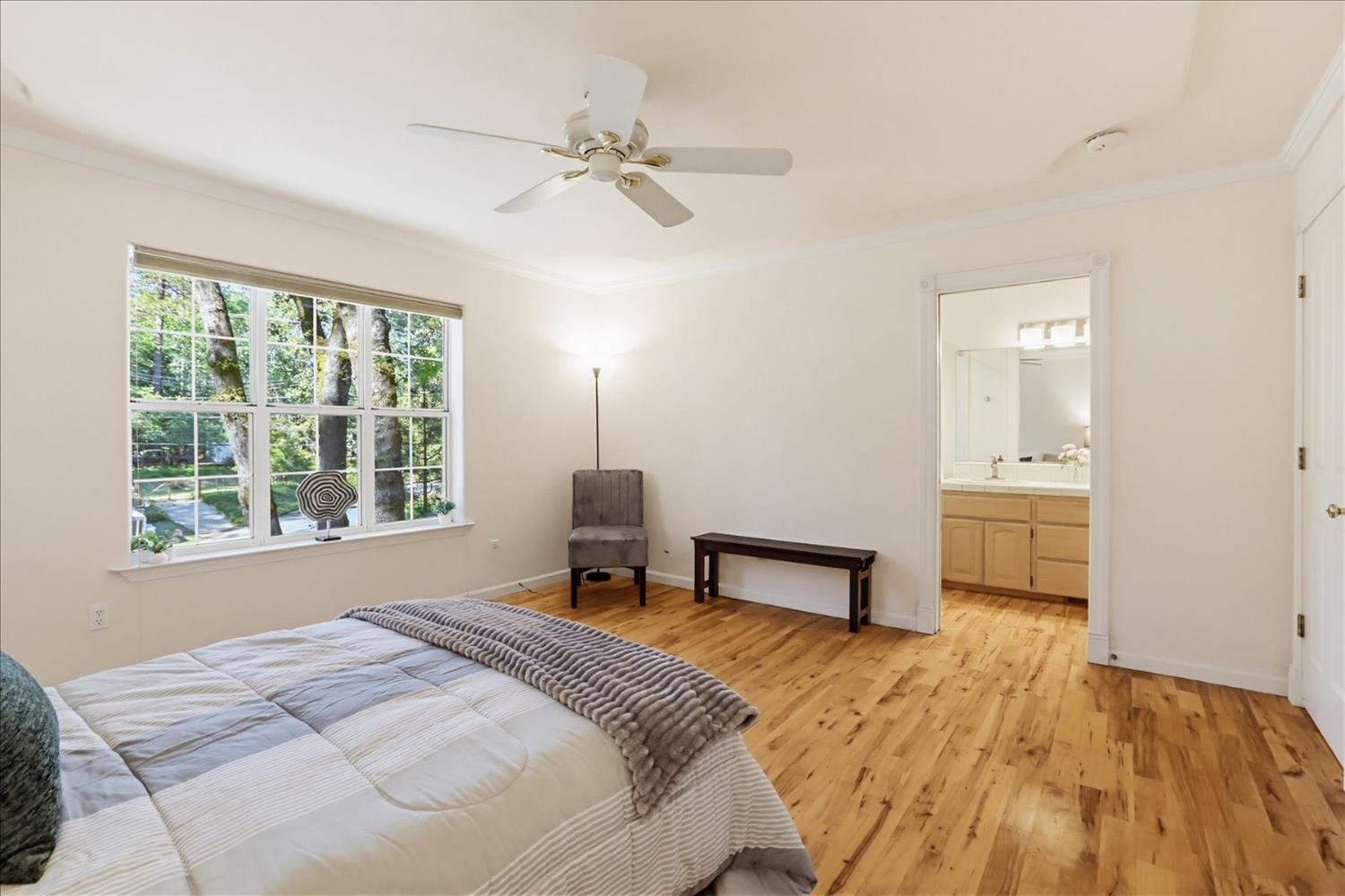 21324 Oak Ridge Drive Grass Valley, CA 95945 - Photo 15 of 32 a bedroom with a bed and a window
