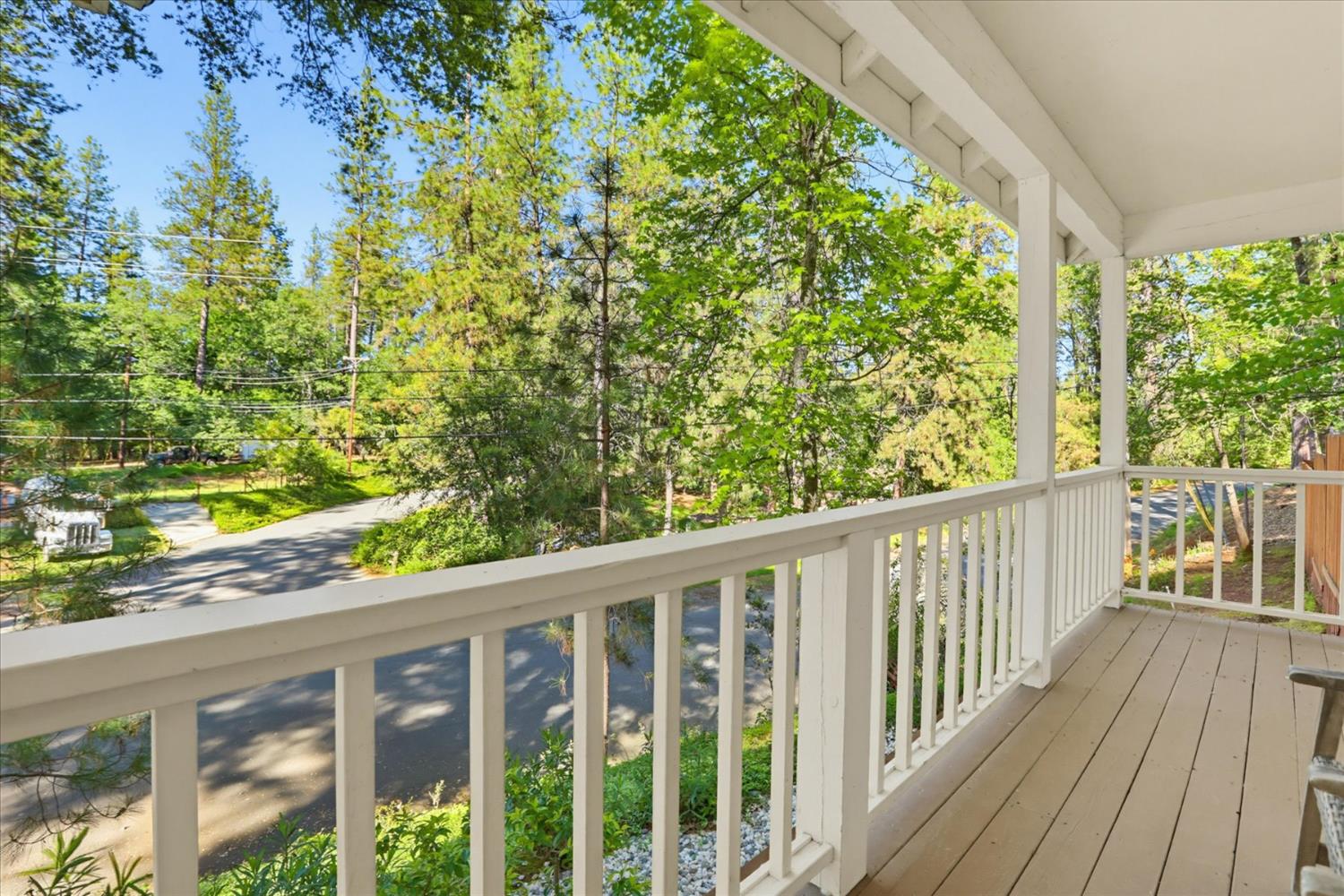 21324 Oak Ridge Drive Grass Valley, CA 95945 - Photo 27 of 32 a view of a wooden deck next to a yard