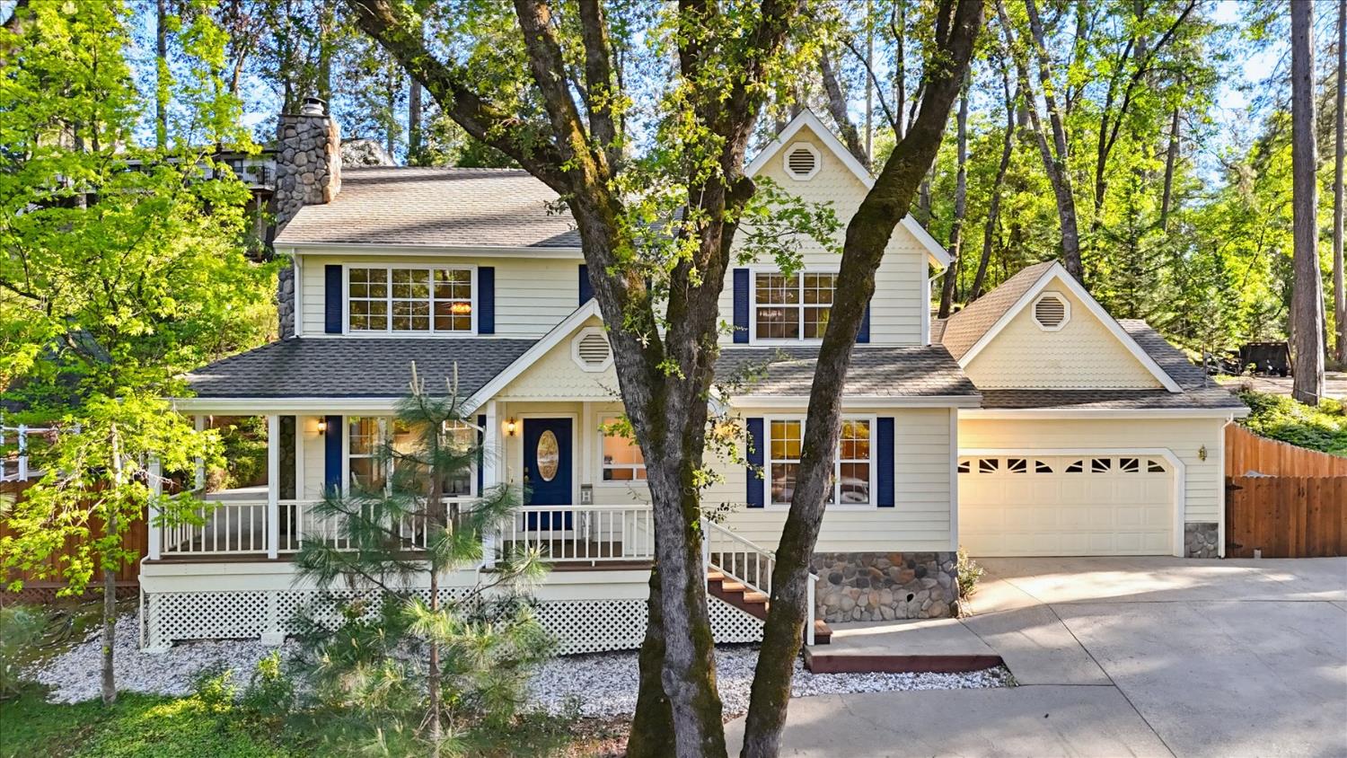 21324 Oak Ridge Drive Grass Valley, CA 95945 - Photo 28 of 32 a front view of a house with a yard
