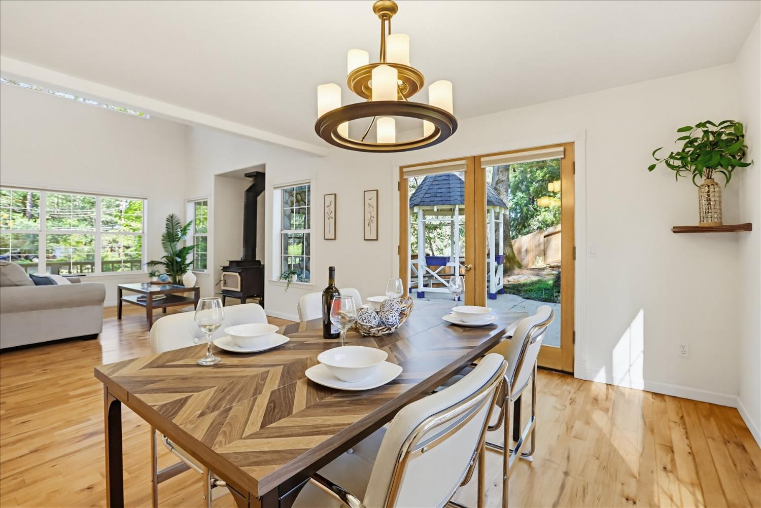 21324 Oak Ridge Drive Grass Valley, CA 95945 - Photo 7 of 32 a view of a dining room with furniture window and wooden floor