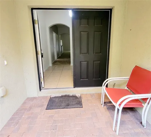a living room with a furniture and a rug