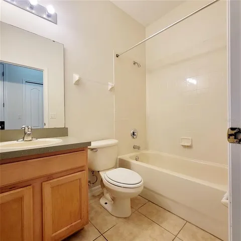 a bathroom with a sink a toilet and a bathtub