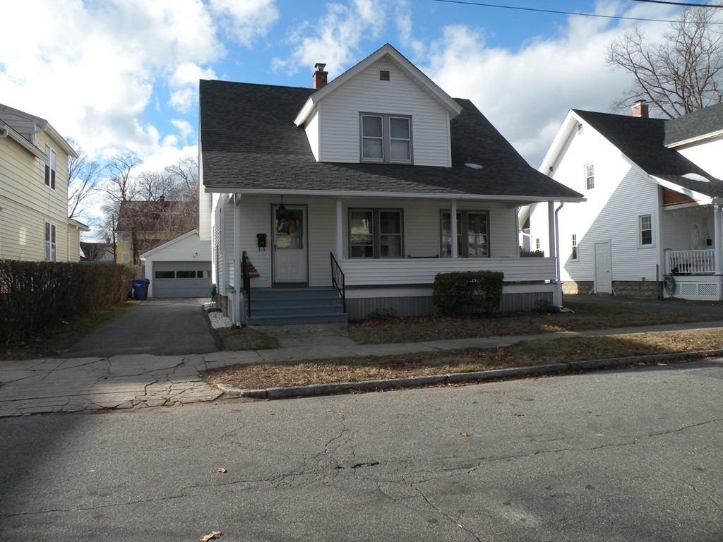 114 Brunswick Street Springfield, MA 01108 - Photo 1 of 15 a front view of a house with a yard