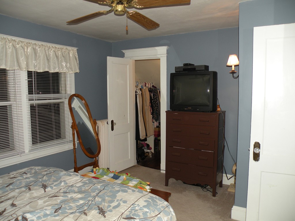 114 Brunswick Street Springfield, MA 01108 - Photo 15 of 15 a room with furniture and a flat screen tv