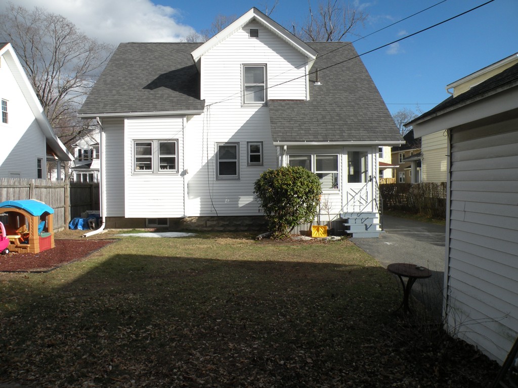 114 Brunswick Street Springfield, MA 01108 - Photo 3 of 15 a front view of a house with a yard