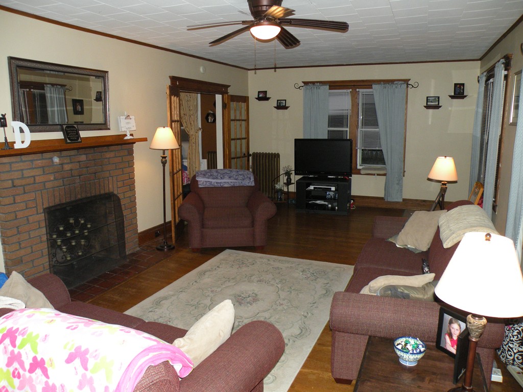 114 Brunswick Street Springfield, MA 01108 - Photo 6 of 15 a living room with furniture and wooden floor