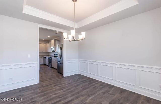 1015 Hot Rod Road New Bern, NC 28562 - Photo 24 of 38 No tray ceiling in Athens Acres. Photos are of the same floor plan in a different community. Color selections, features and finishes may vary. Pictures are for layout purposes only.
