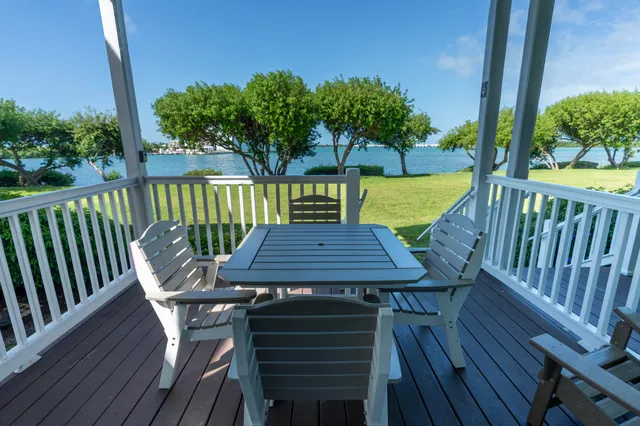 a view of a table and chairs on the roof deck