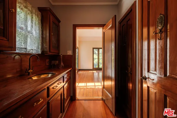 a kitchen with stainless steel appliances granite countertop a sink and cabinets