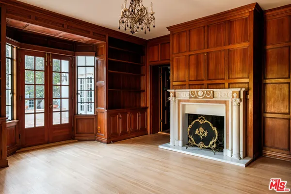 a view of fireplace and wooden floor