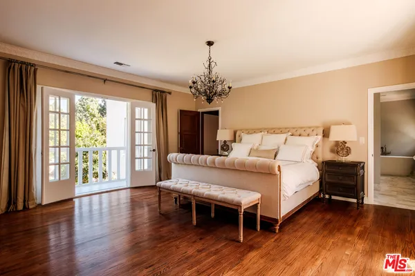 a white bath tub sitting next to a white sink