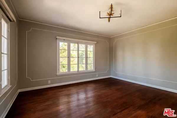 a view of a house with swimming pool and sitting area