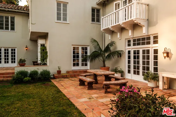 a view of a room with a yard and potted plants