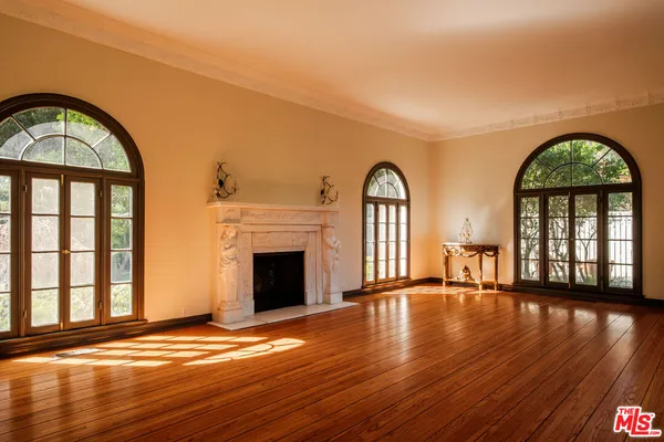 a view of an entryway with wooden floor