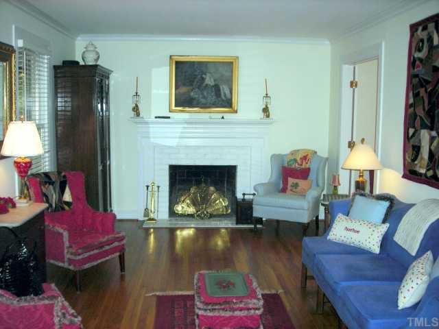 707 Richmond Street Raleigh, NC 27609 - Photo 3 of 12 Beautiful formal living room features fireplace with gas logs, hardwoods and crown molding Living Room