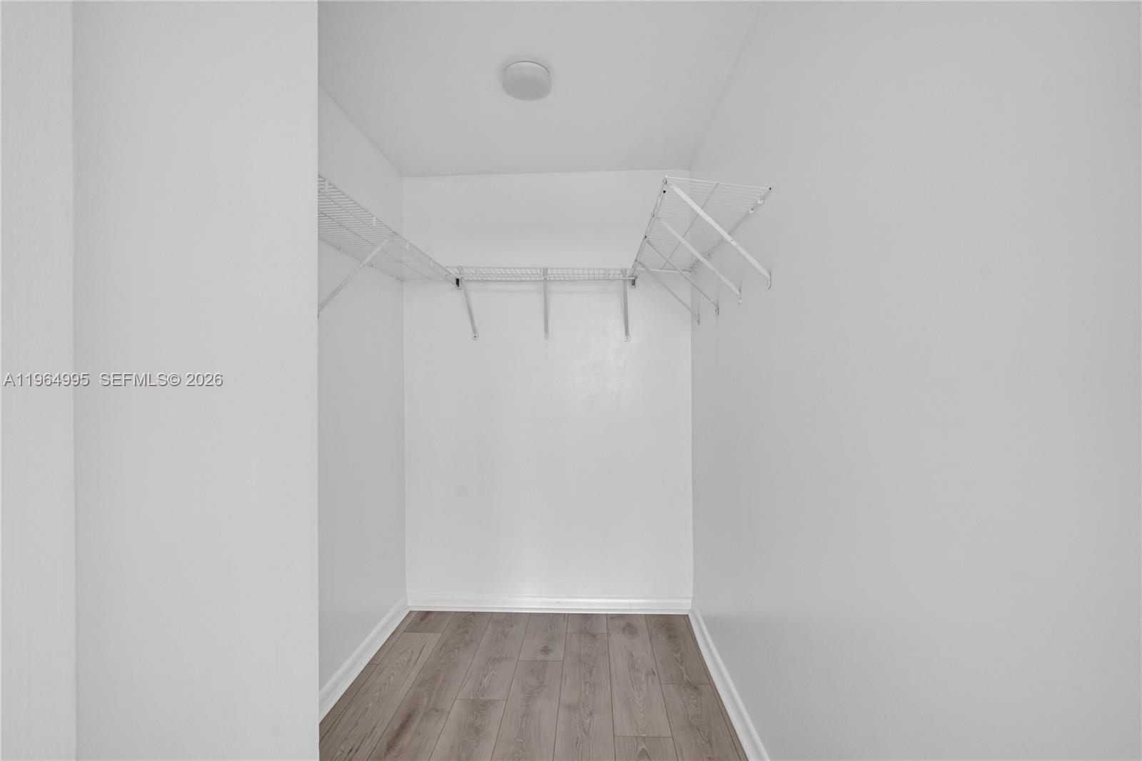 244 Biscayne Boulevard, Unit 436 Miami, FL 33132 - Photo 22 of 43 a view of a room with racks on the wall