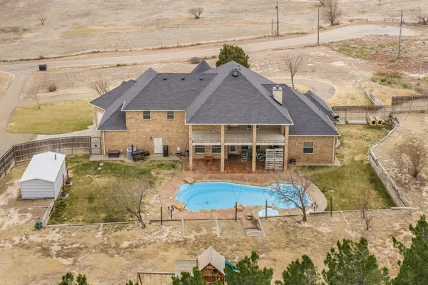 an aerial view of residential houses with outdoor space