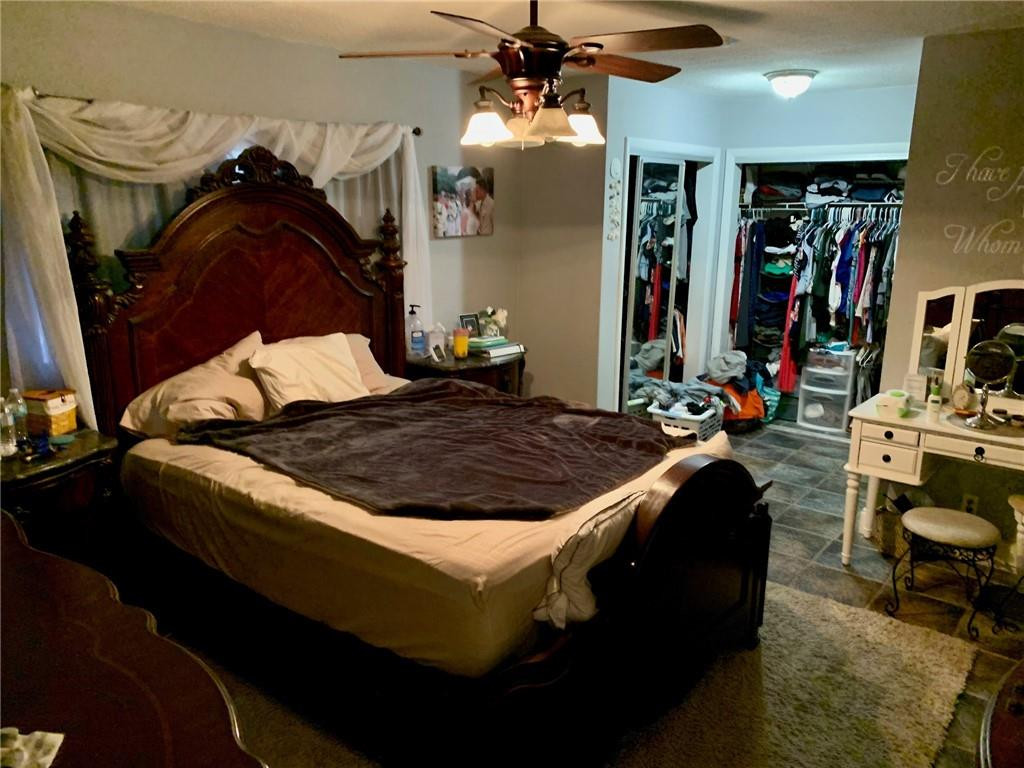 5261 Southwest 7th Street Margate, FL 33068 - Photo 12 of 17 a bed sitting in a bedroom next to a window