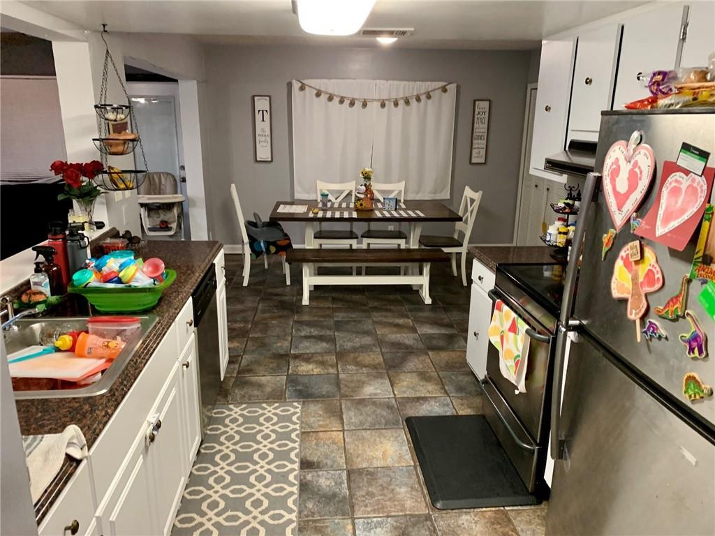 5261 Southwest 7th Street Margate, FL 33068 - Photo 3 of 17 a dining room with lots of furniture and toys