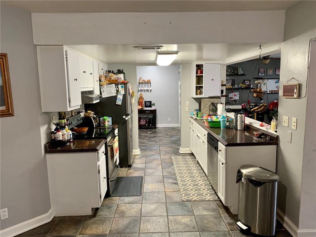 5261 Southwest 7th Street Margate, FL 33068 - Photo 5 of 17 a view of a kitchen with fridge and workspace