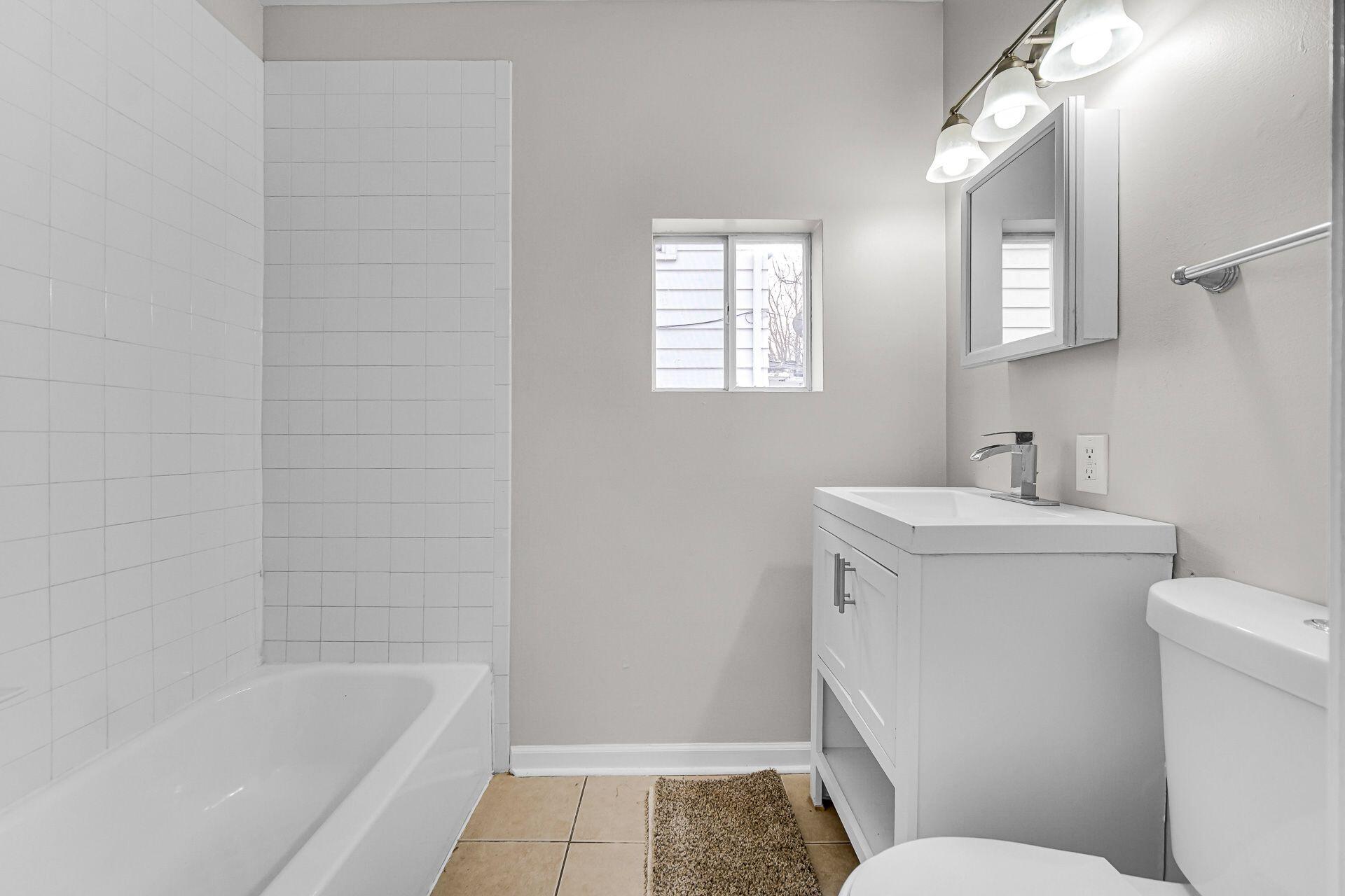 6220 Garfield Avenue Hammond, IN 46324 - Photo 11 of 20 a bathroom with a sink a toilet and shower