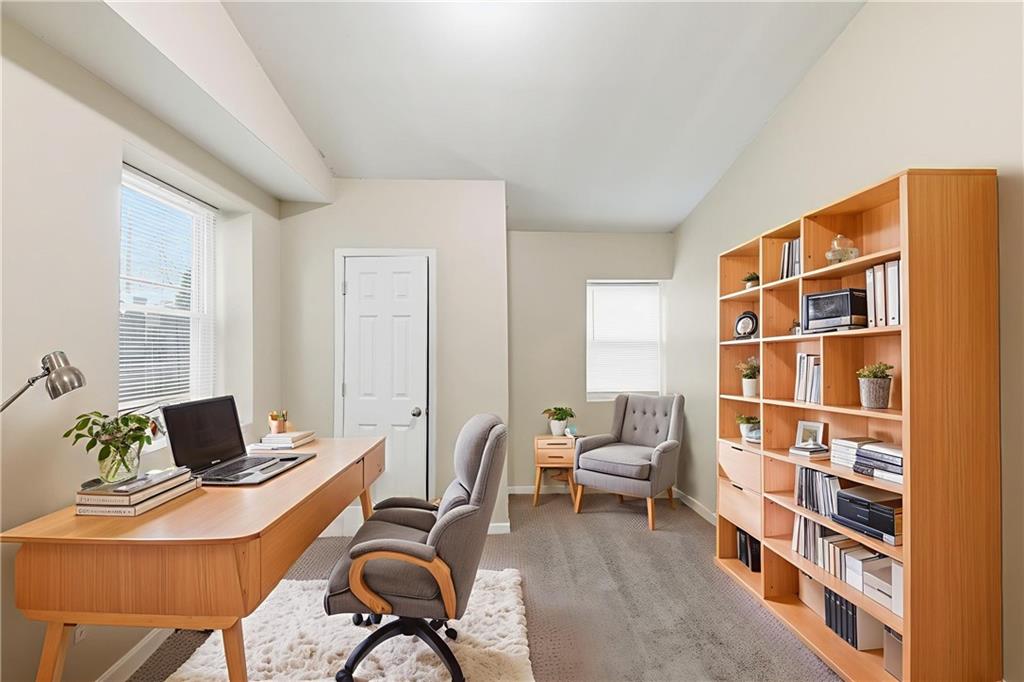 94 Ericson Street Southeast Atlanta, GA 30317 - Photo 12 of 39 a work room with furniture and book shelf