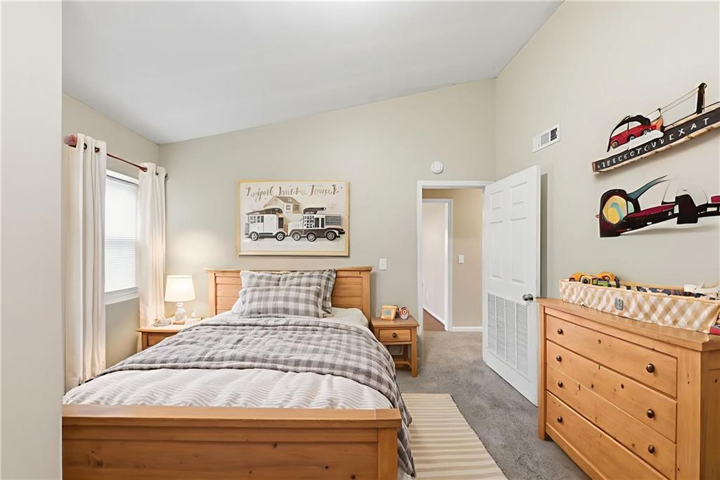 94 Ericson Street Southeast Atlanta, GA 30317 - Photo 14 of 39 a bedroom with a bed and a dresser